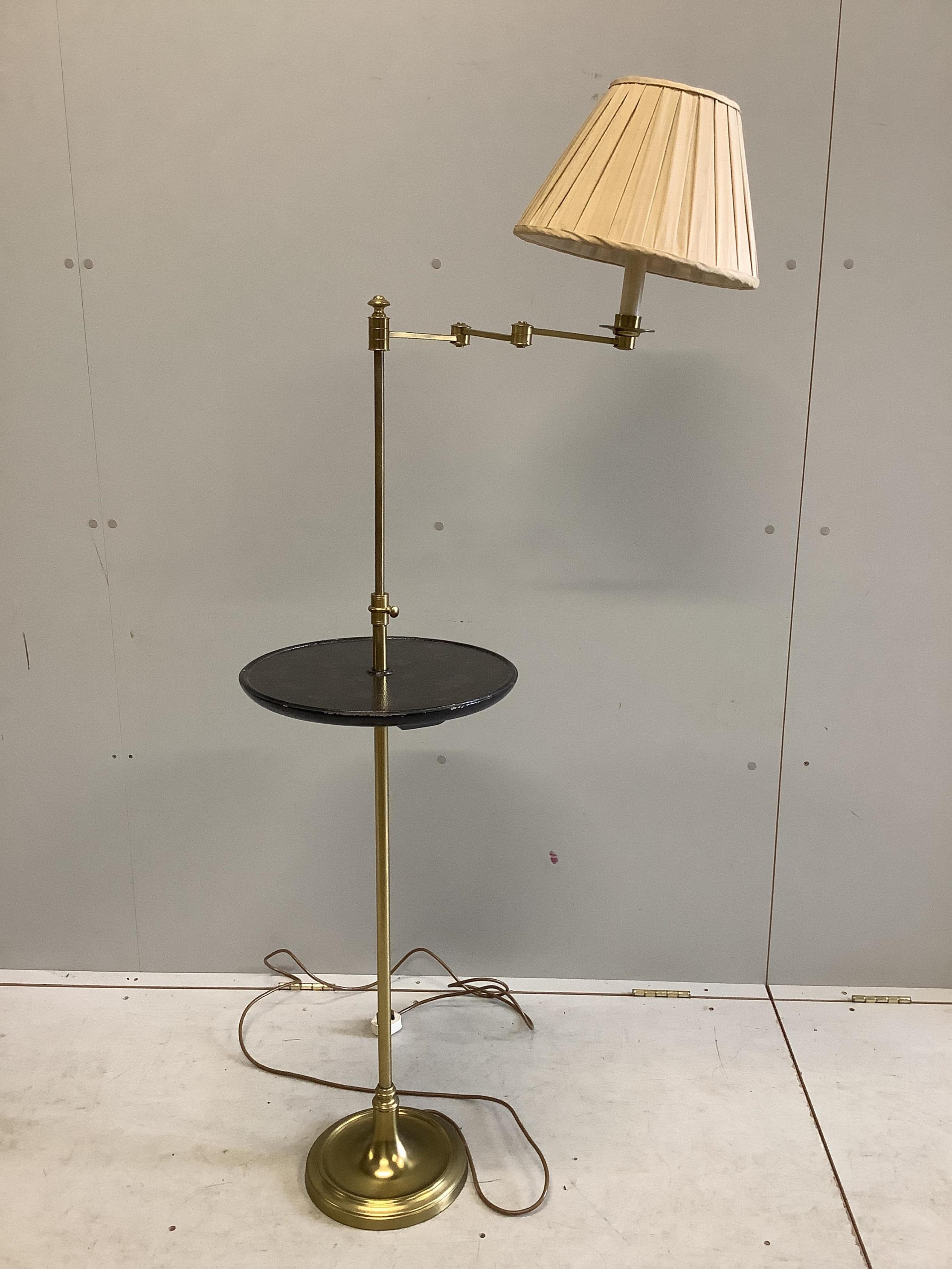 A telescopic standard lamp with a lacquered shelf, height 152cm. Condition - fair